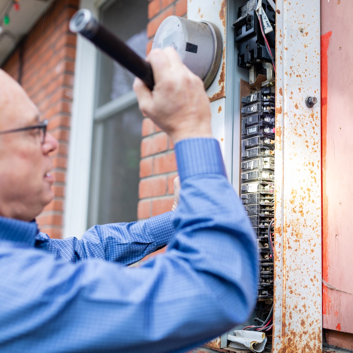 David inspecting an electrical panel